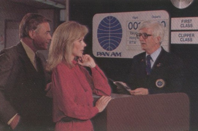 1983, January, A Special Service Agent with gold crest on his jacket  assists customers traveling on Pan Am flight 001 from Los Angeles to Tokyo.